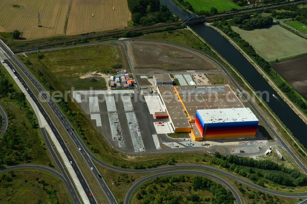 Aerial photograph Wustermark - Construction site and assembly work for the construction of a high-bay warehouse building complex and logistics center on the premises dm VZ Verteilerzentrum in Wustermark in the state Brandenburg, Germany