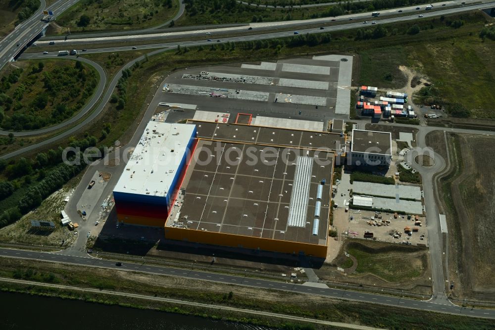 Aerial image Wustermark - Construction site and assembly work for the construction of a high-bay warehouse building complex and logistics center on the premises dm VZ Verteilerzentrum in Wustermark in the state Brandenburg, Germany