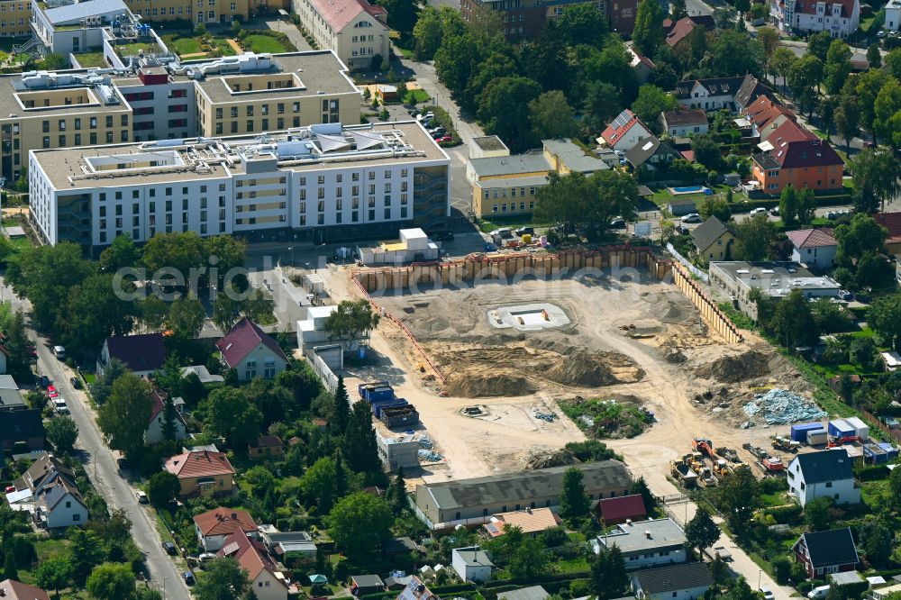 Berlin from above - Construction site to build a new multi-family residential complex on street Muensterberger Weg in the district Kaulsdorf in Berlin, Germany