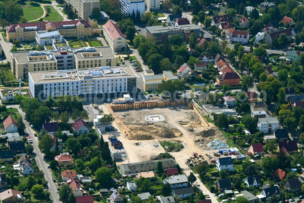 Berlin from the bird's eye view: Construction site to build a new multi-family residential complex on street Muensterberger Weg in the district Kaulsdorf in Berlin, Germany