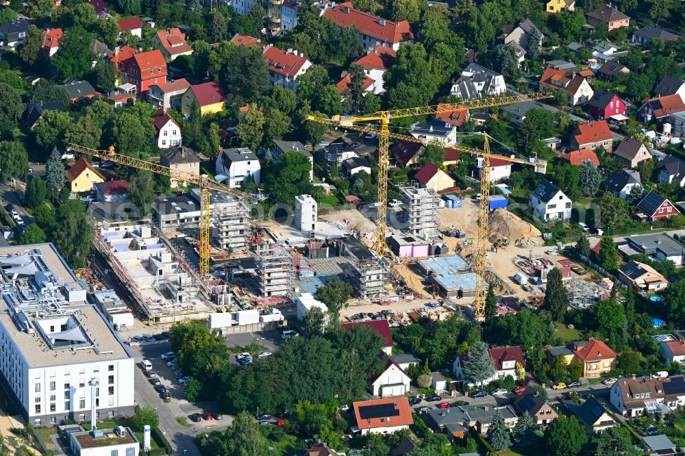 Aerial image Berlin - Construction site to build a new multi-family residential complex on street Muensterberger Weg in the district Kaulsdorf in Berlin, Germany