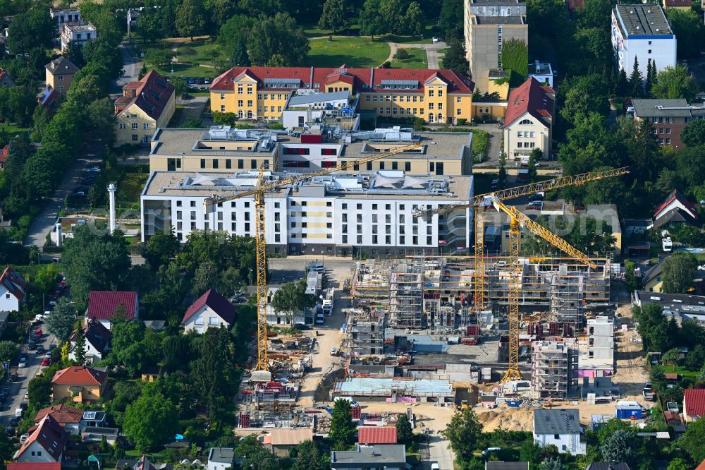 Berlin from the bird's eye view: Construction site to build a new multi-family residential complex on street Muensterberger Weg in the district Kaulsdorf in Berlin, Germany