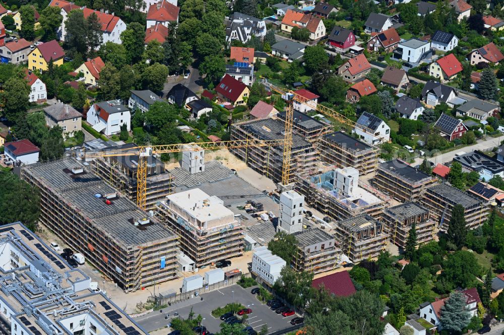 Berlin from the bird's eye view: Construction site to build a new multi-family residential complex on street Muensterberger Weg in the district Kaulsdorf in Berlin, Germany