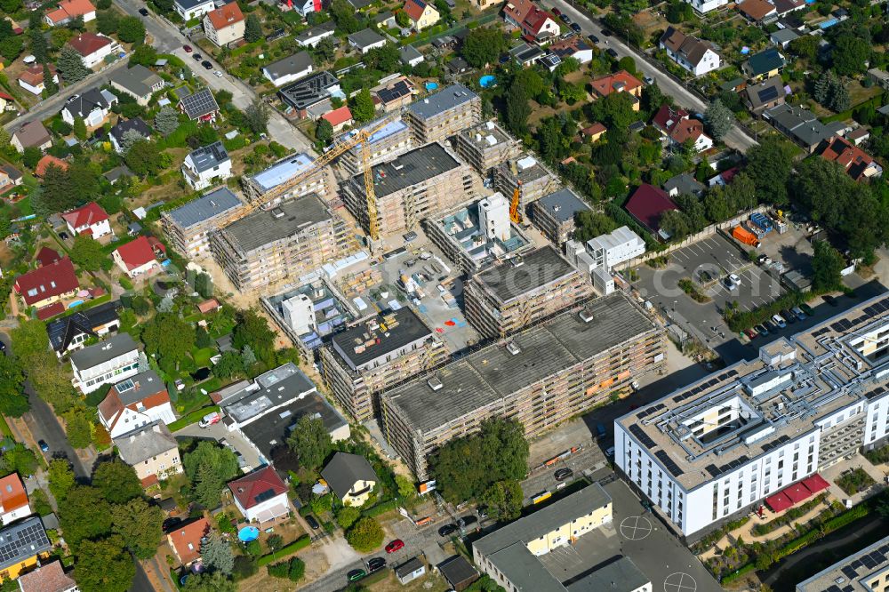 Berlin from above - Construction site to build a new multi-family residential complex on street Muensterberger Weg in the district Kaulsdorf in Berlin, Germany