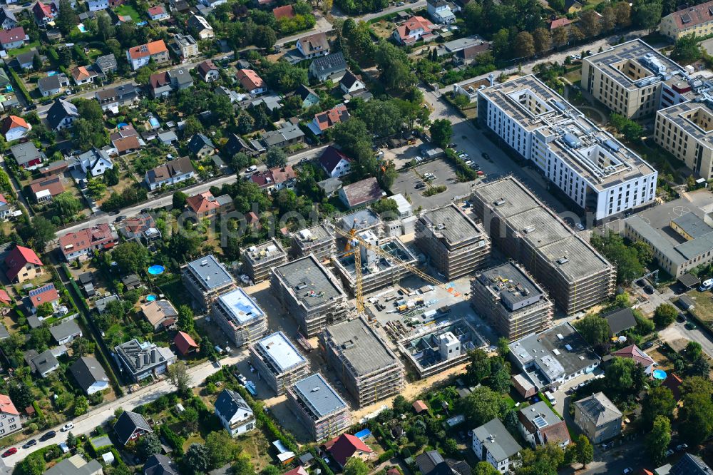 Berlin from above - Construction site to build a new multi-family residential complex on street Muensterberger Weg in the district Kaulsdorf in Berlin, Germany