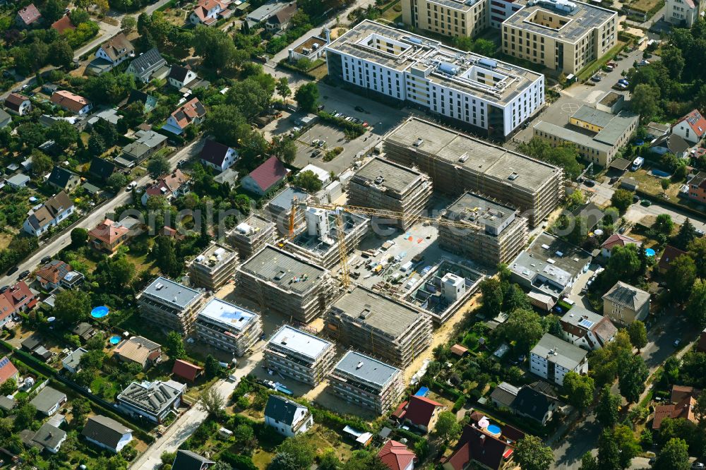 Berlin from the bird's eye view: Construction site to build a new multi-family residential complex on street Muensterberger Weg in the district Kaulsdorf in Berlin, Germany