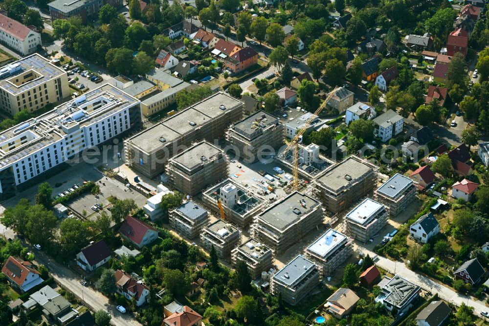 Berlin from above - Construction site to build a new multi-family residential complex on street Muensterberger Weg in the district Kaulsdorf in Berlin, Germany