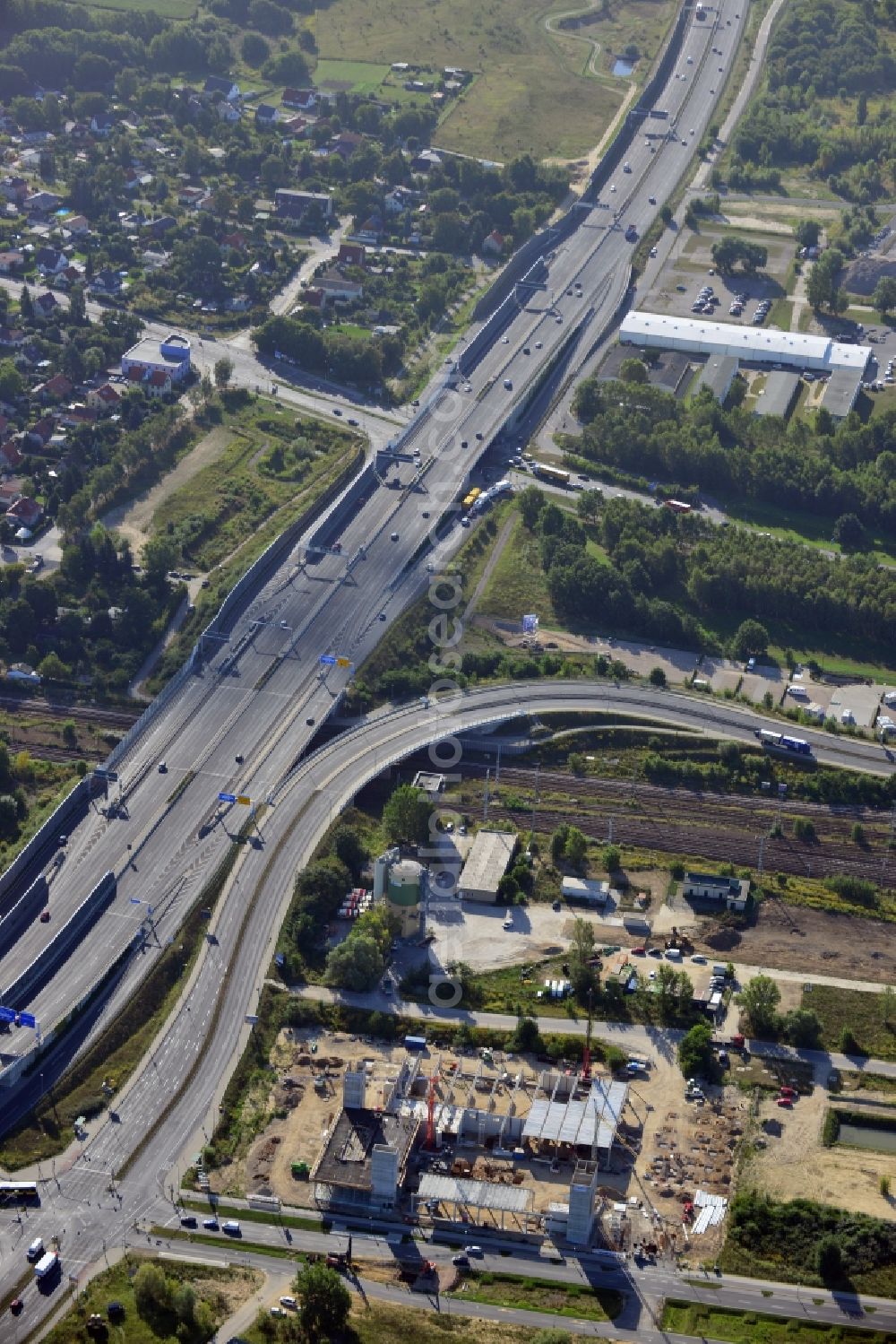 Aerial image Schönefeld - Look at the construction site of a new building of an industrial hall at the Hans-Grade-Allee in Schönefeld in Brandenburg. Construction company is the company Hundhausen