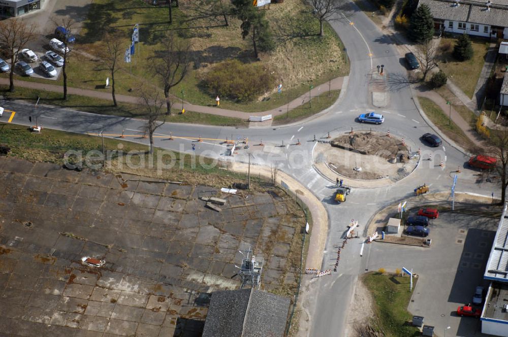 Werneuchen from the bird's eye view: Blick auf den Neubau des Kreisverkehr an der Kreuzung Freienwalder Chaussee (B158) / Alte Hirschfelder Straße in Werneuchen. Der erst vor wenigen Jahren im Zuge des Neubaues der B158 erbaute Kreisverkehr wird zur Zeit erneut umgebaut, damit er künftig von Groß- und Schwerlasttransporten besser befahren werden kann. Ende April sollen die Arbeiten abgeschlossen sein. Ausführende Baufirmen: BERGER BAU GmbH und Schüßler-Plan Ingenieurgesellschaft mbH