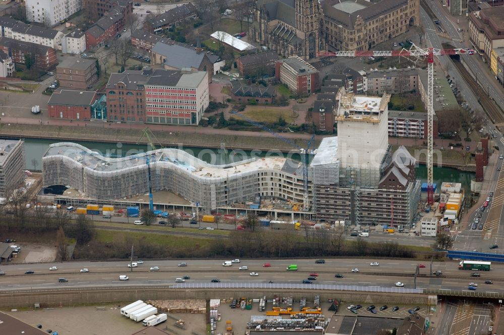 Duisburg from above - DUISBURG 02/20/2012 view of the NRW State Archives building on a former wharf site of the Duisburg inner harbor. Hochtief Construction AG NRW built here designed by the architects Ortner & Ortner architecture a 160m long shaft with a 76m high tower archives