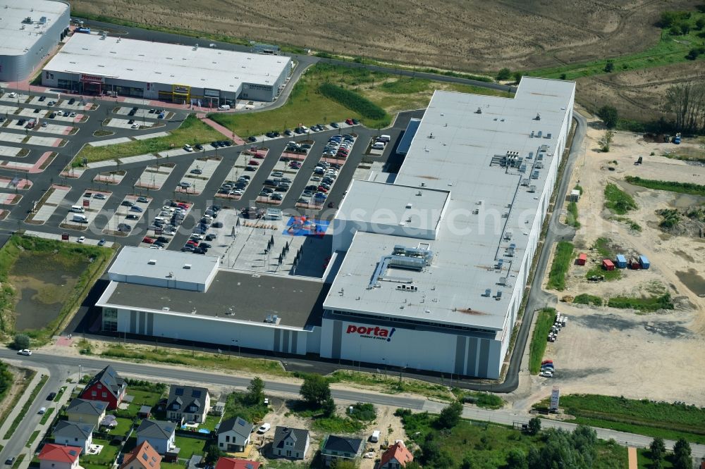 Aerial photograph Berlin - Construction site for the new building home-center of the Porta-Group at Pilgramer street in the district Mahlsdorf in Berlin