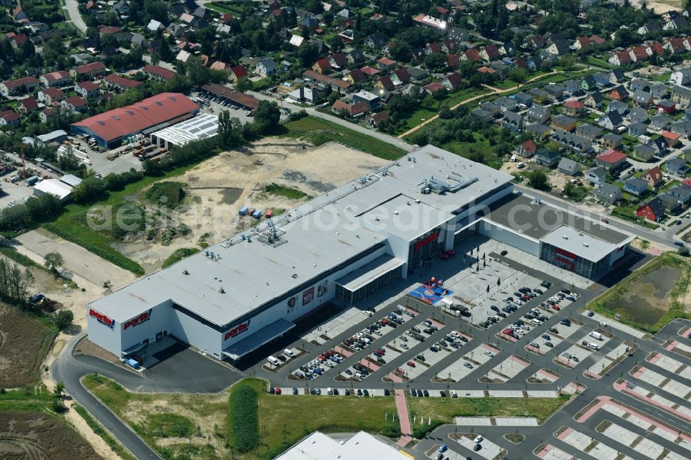 Aerial image Berlin - Construction site for the new building home-center of the Porta-Group at Pilgramer street in the district Mahlsdorf in Berlin