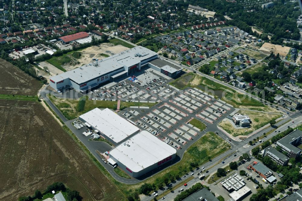 Aerial photograph Berlin - Construction site for the new building home-center of the Porta-Group at Pilgramer street in the district Mahlsdorf in Berlin