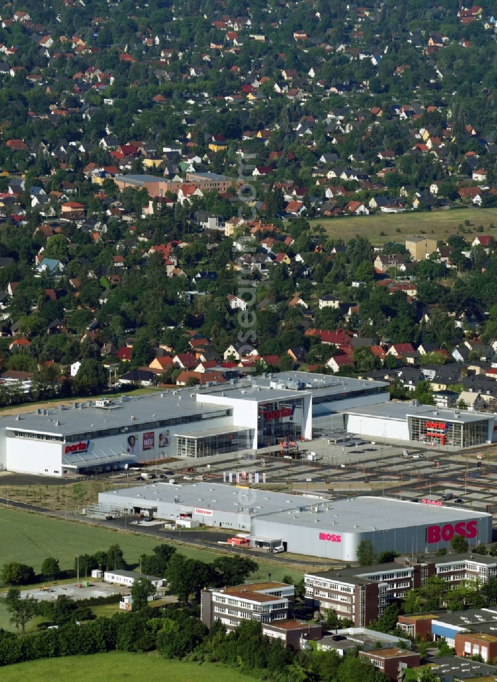 Aerial image Berlin - Construction site for the new building home-center of the Porta-Group at Pilgramer street in the district Mahlsdorf in Berlin