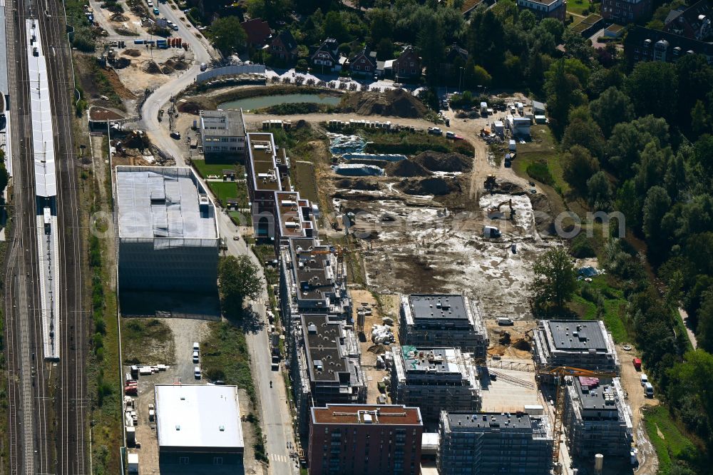 Pinneberg from the bird's eye view: Construction site to build a new multi-family residential complex Auenhoefe on street An der Muehlenau in Pinneberg in the state Schleswig-Holstein, Germany