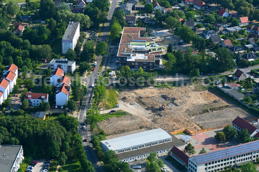 Bernau from the bird's eye view: Construction site to build a new multi-family residential complex on street Ladeburger Chaussee - Sachtelebenstrasse in Bernau in the state Brandenburg, Germany