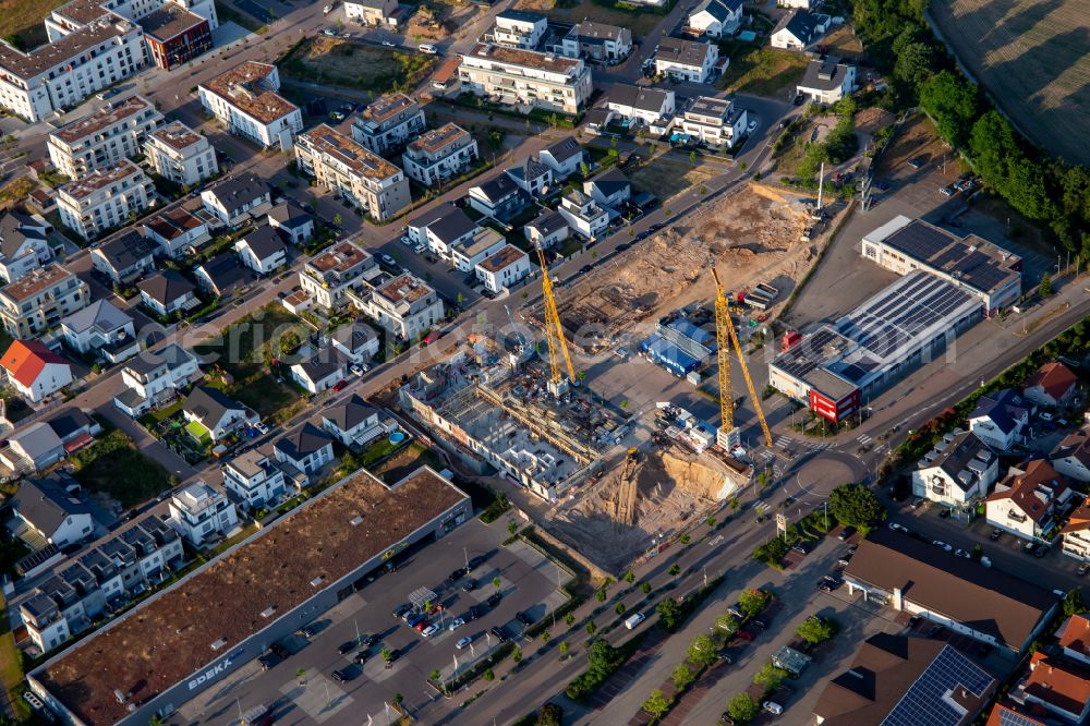 Linkenheim-Hochstetten from above - Construction site to build a new multi-family residential complex Am Biegen on street Am Wall in the district Leopoldshafen in Linkenheim-Hochstetten in the state Baden-Wuerttemberg, Germany