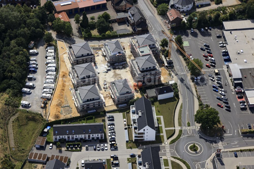 Brüggen from above - Construction site for the new construction of a multi-family residential complex of CD Niederrhein Projekt GmbH on Borner Strasse in Brueggen in the federal state of North Rhine-Westphalia, Germany