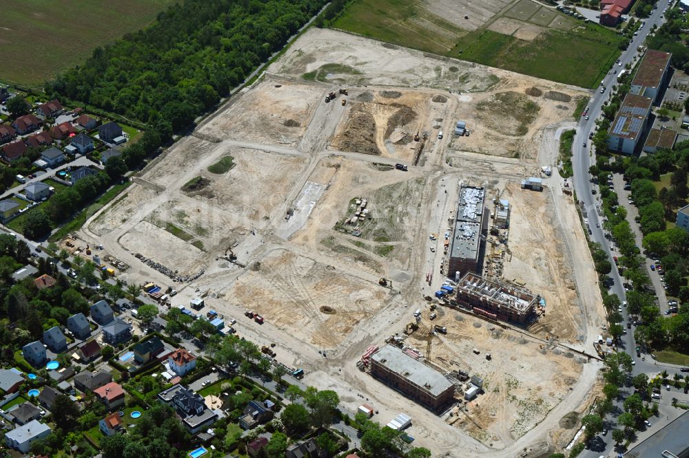 Berlin from the bird's eye view: Construction site to build a new multi-family residential complex Buckower Felder on street Gerlinger Strasse in the district Buckow in Berlin, Germany