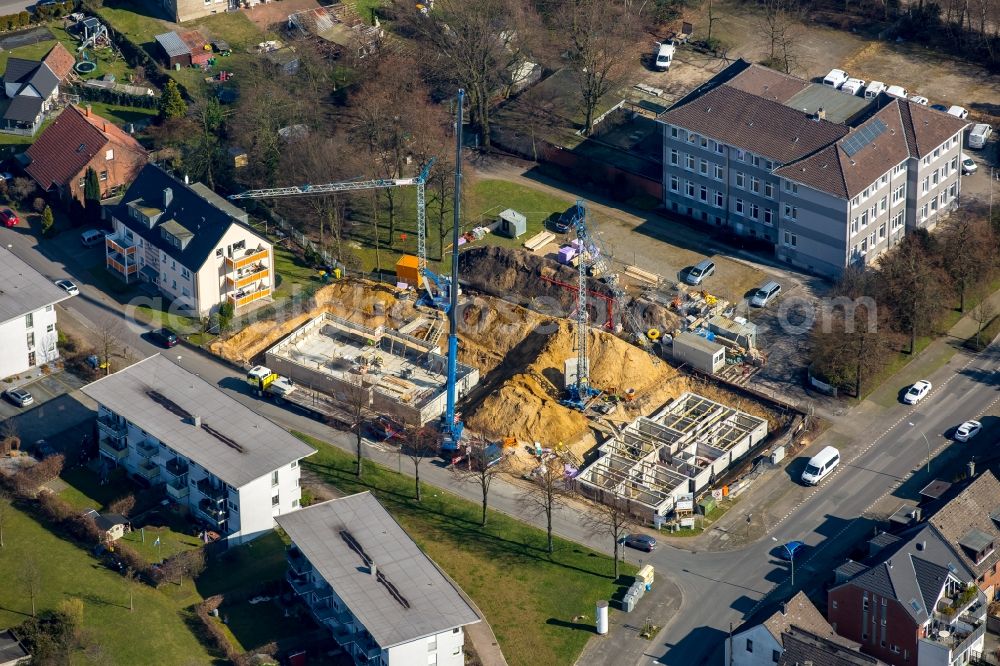 Aerial photograph Bottrop - Construction site to build a new multi-family residential complex at the Tannenstrasse and Trappenstrasse, which will initially be used as a refugee accommodation in Bottrop in the state North Rhine-Westphalia