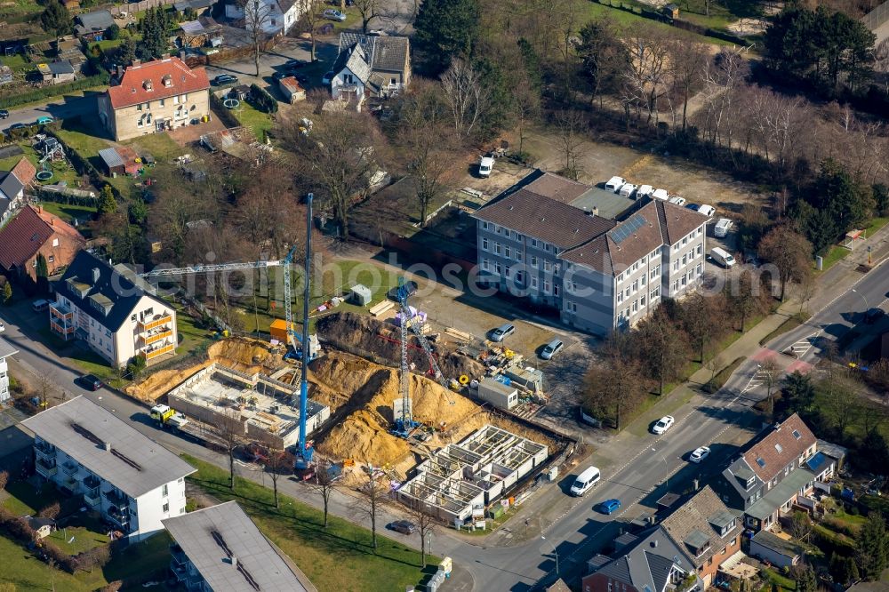 Aerial photograph Bottrop - Construction site to build a new multi-family residential complex at the Tannenstrasse and Trappenstrasse, which will initially be used as a refugee accommodation in Bottrop in the state North Rhine-Westphalia