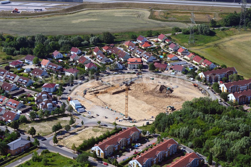 Schwanebeck from the bird's eye view: Construction site to build a new multi-family residential complex Am Eichenring in Schwanebeck in the state Brandenburg, Germany