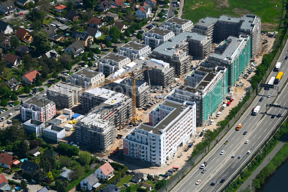 Berlin from the bird's eye view: Construction site to build a new multi-family residential complex on Eisenhutweg in the district Johannisthal in Berlin, Germany