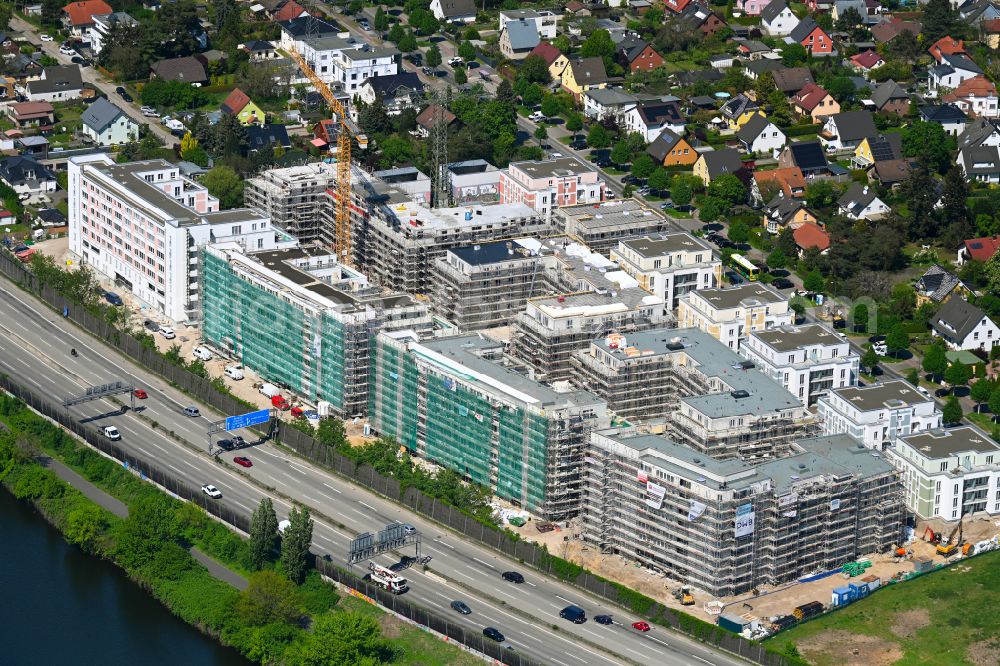 Berlin from the bird's eye view: Construction site to build a new multi-family residential complex on Eisenhutweg in the district Johannisthal in Berlin, Germany