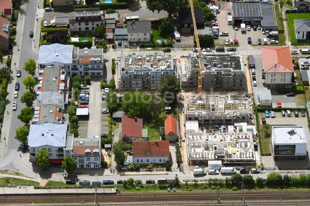 Falkensee from the bird's eye view: Construction site to build a new multi-family residential complex Falkenhoefe on street Heinkelstrasse in Falkensee in the state Brandenburg, Germany