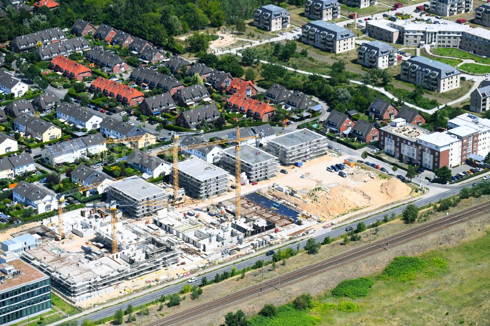 Falkensee from the bird's eye view: Construction site to build a new multi-family residential complex on street Seegefelder Strasse in Falkensee in the state Brandenburg, Germany