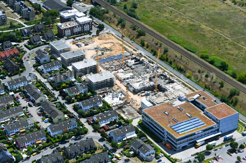 Aerial photograph Falkensee - Construction site to build a new multi-family residential complex on street Seegefelder Strasse in Falkensee in the state Brandenburg, Germany