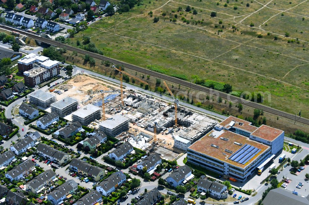 Falkensee from above - Construction site to build a new multi-family residential complex on street Seegefelder Strasse in Falkensee in the state Brandenburg, Germany