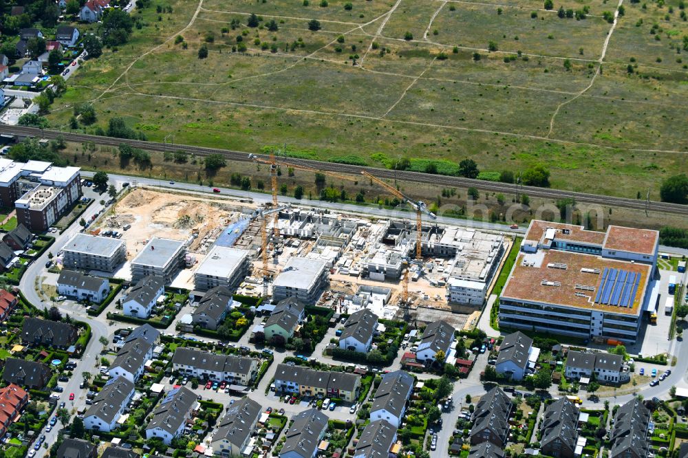 Falkensee from the bird's eye view: Construction site to build a new multi-family residential complex on street Seegefelder Strasse in Falkensee in the state Brandenburg, Germany