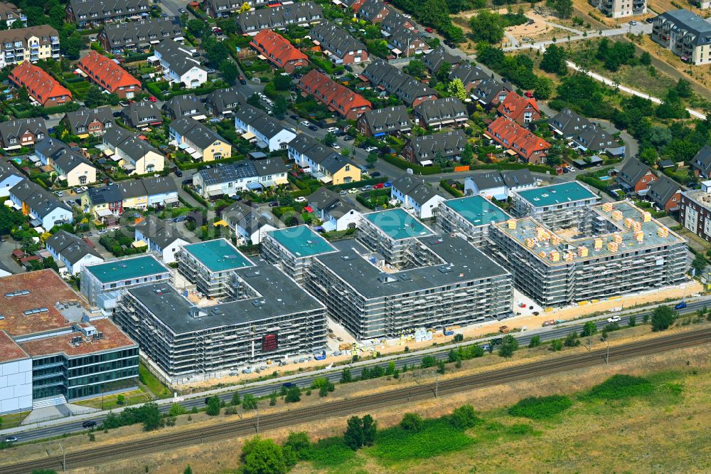 Aerial photograph Falkensee - Construction site to build a new multi-family residential complex on street Seegefelder Strasse in Falkensee in the state Brandenburg, Germany