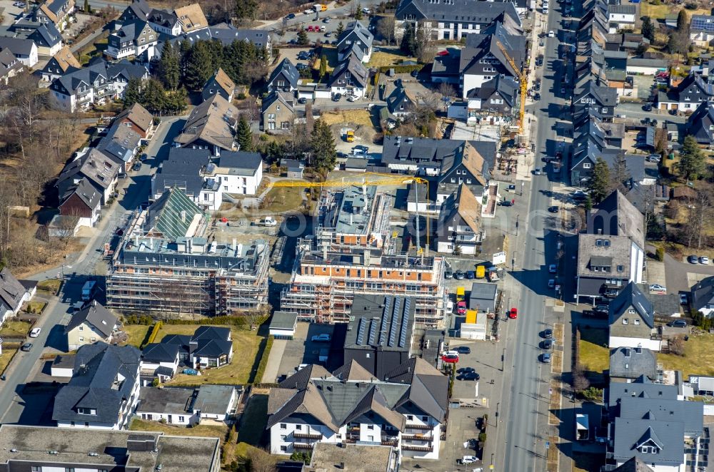 Aerial image Winterberg - Construction site to build a new multi-family residential complex with Ferienwohnungen Am Waltenberg - Ferienstrasse in Winterberg at Sauerland in the state North Rhine-Westphalia, Germany