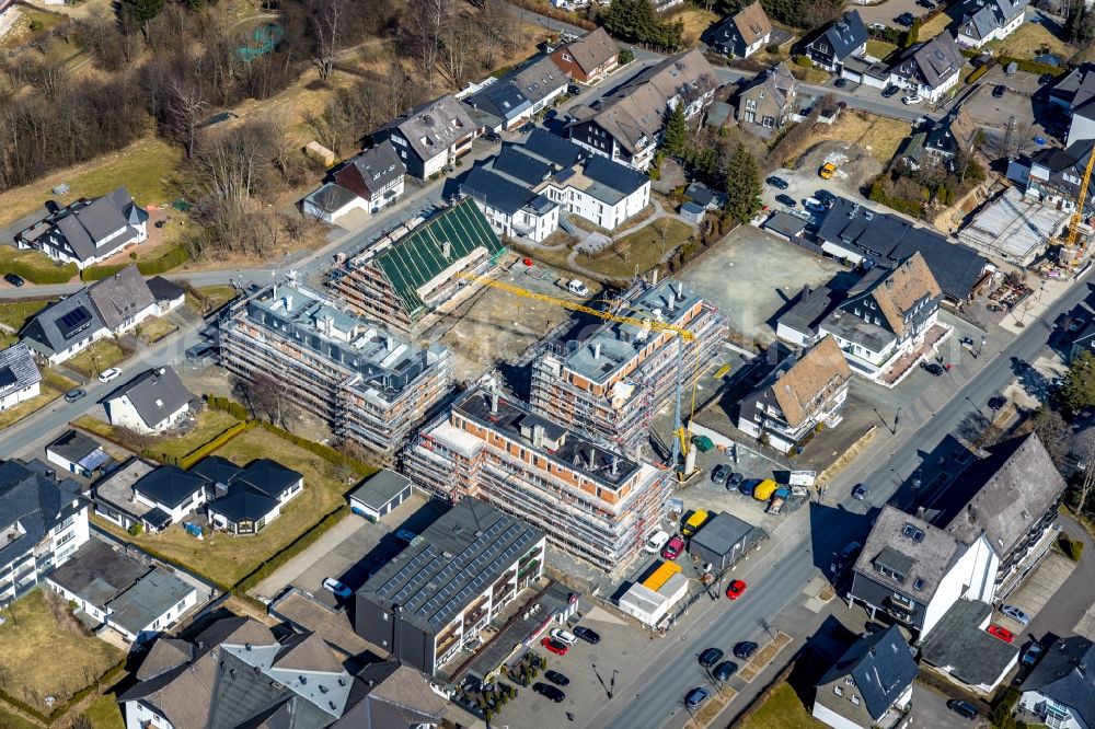 Aerial photograph Winterberg - Construction site to build a new multi-family residential complex with Ferienwohnungen Am Waltenberg - Ferienstrasse in Winterberg at Sauerland in the state North Rhine-Westphalia, Germany