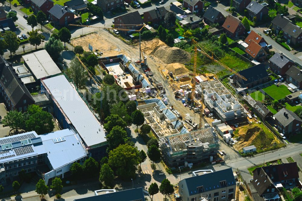 Aerial photograph Borken - Construction site to build a new multi-family residential complex Hawerkaempen Quartier on street Auf der Fluet - Hawerkaempe in Borken in the state North Rhine-Westphalia, Germany