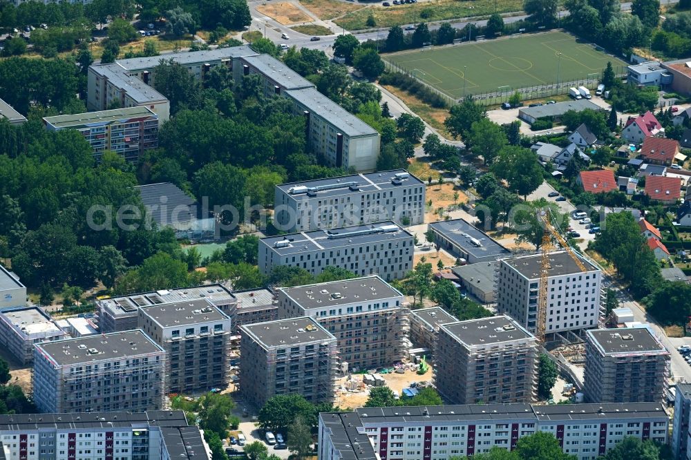 Berlin from the bird's eye view: Construction site to build a new multi-family residential complex on Karl-Holtz-Strasse in the district Marzahn in Berlin, Germany