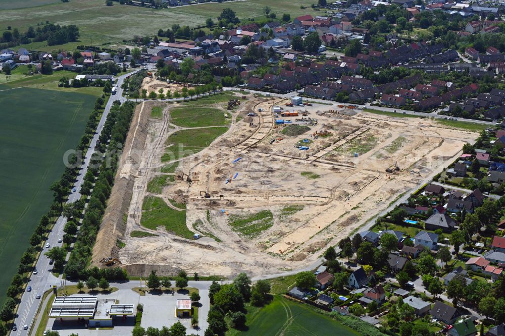 Ahrensfelde from the bird's eye view: Construction site to build a new multi-family residential complex Kirschenallee on street Blumberger Chaussee in Ahrensfelde in the state Brandenburg, Germany