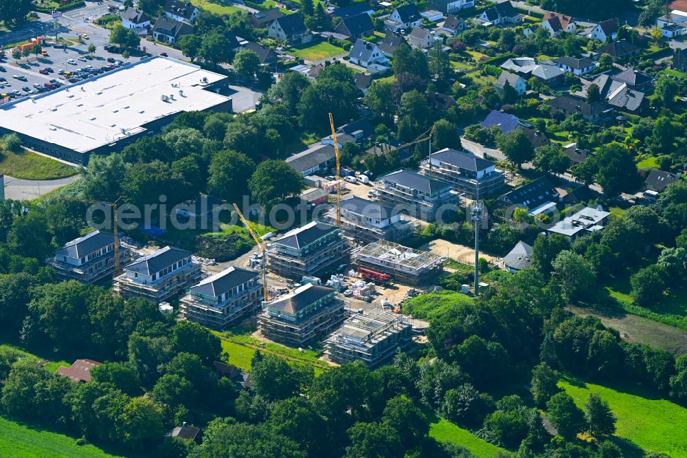 Langen from above - Construction site to build a new multi-family residential complex on street Narbensweg - Schmidtkuhlsweg in Langen in the state Lower Saxony, Germany