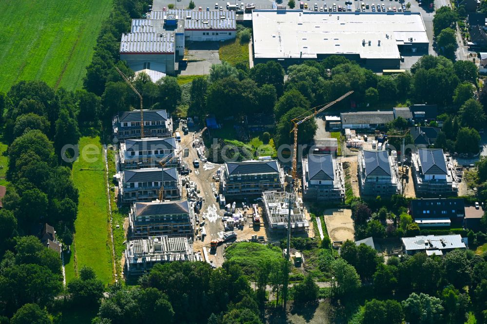 Langen from the bird's eye view: Construction site to build a new multi-family residential complex on street Narbensweg - Schmidtkuhlsweg in Langen in the state Lower Saxony, Germany