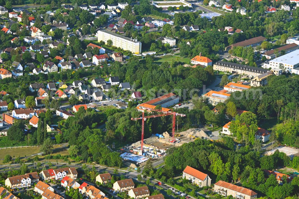 Berlin from the bird's eye view: Construction site to build a new multi-family residential complex on street Am Eidechsenweg - Brunsbuetteler Damm in the district Staaken in Berlin, Germany