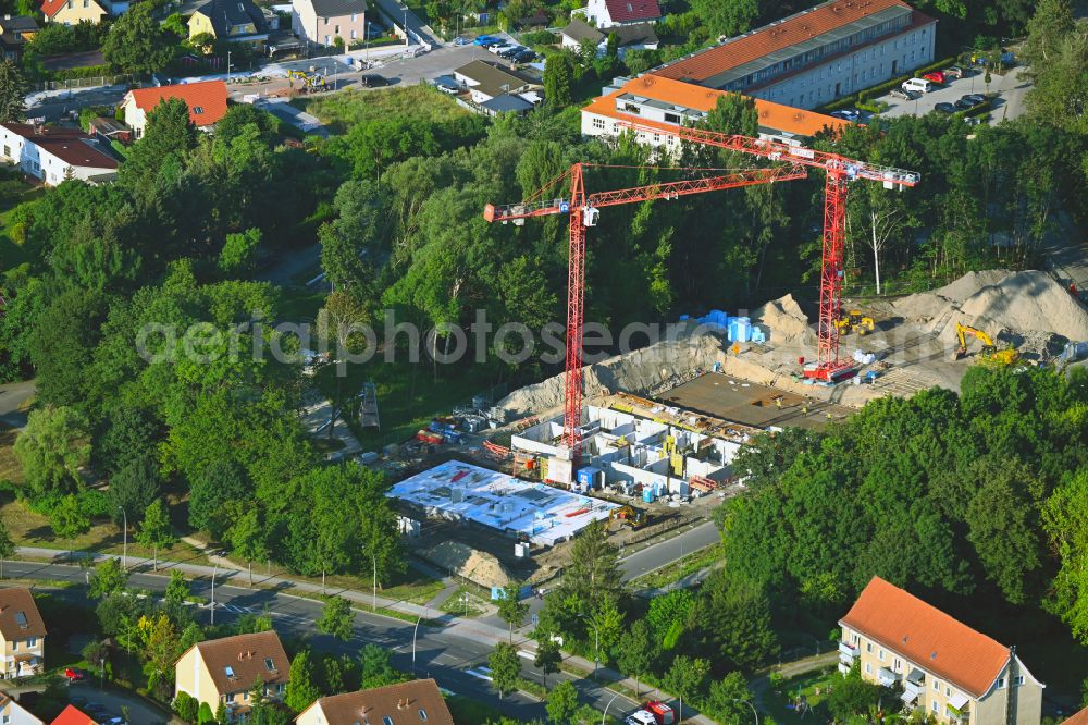 Aerial image Berlin - Construction site to build a new multi-family residential complex on street Am Eidechsenweg - Brunsbuetteler Damm in the district Staaken in Berlin, Germany