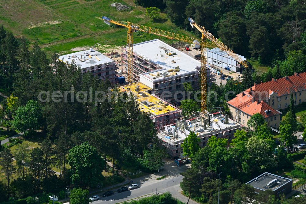 Berlin from the bird's eye view: Construction site to build a new multi-family residential complex on street Plueschowstrasse - Sven-Hedin-Strasse in the district Zehlendorf in Berlin, Germany