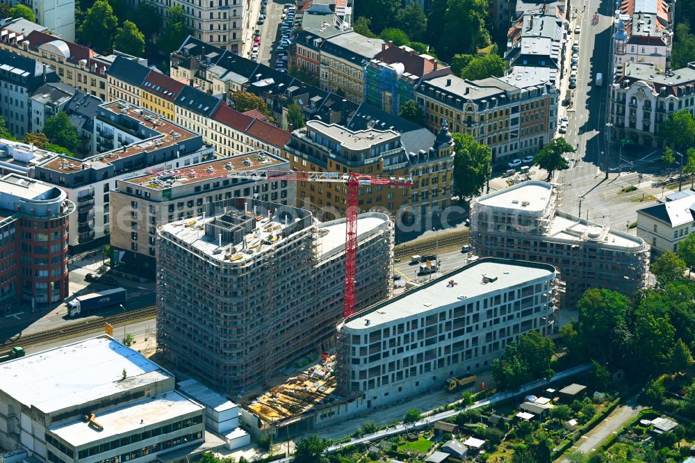 Leipzig from the bird's eye view: Construction site to build a new multi-family residential complex on Prager Strasse corner Johannisallee in the district Zentrum-Suedost in Leipzig in the state Saxony, Germany