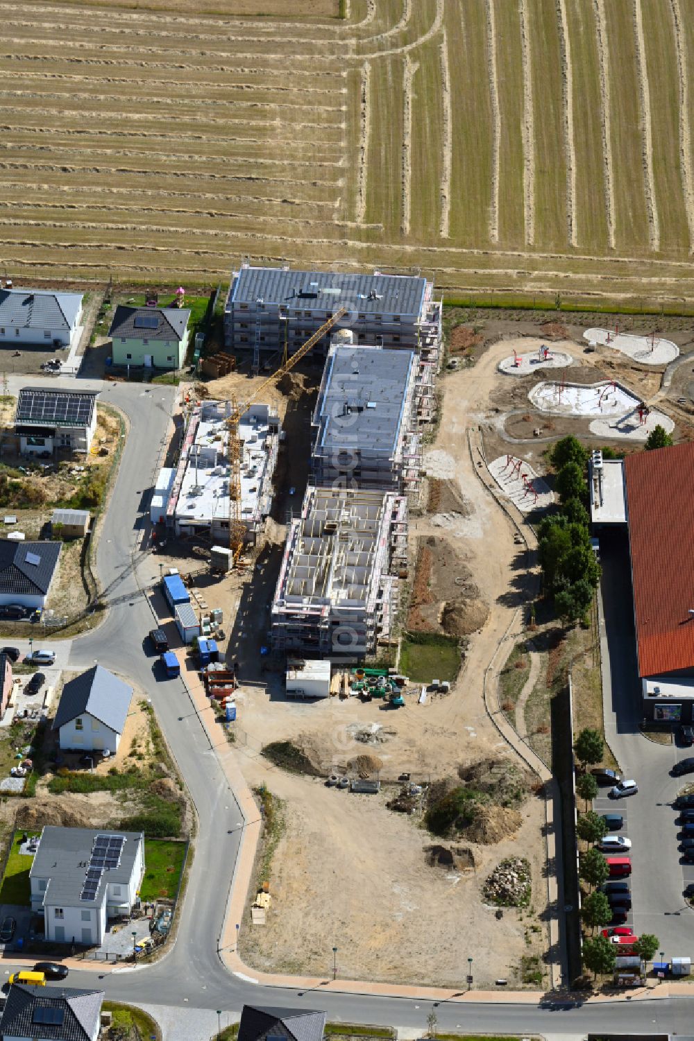 Bernau from the bird's eye view: Construction site to build a new multi-family residential complex Refugium Heideglueck in the district Schoenow in Bernau in the state Brandenburg, Germany