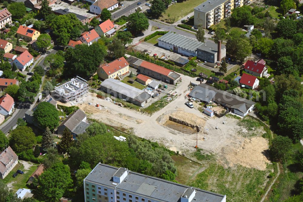 Berlin from above - Construction site for the new construction of a multi-family residential complex Wartenberger Anger on Dorfstrasse - Zum Wartenberger Anger in the Wartenberg district of Berlin, Germany