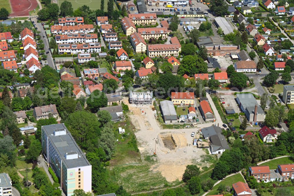 Berlin from the bird's eye view: Construction site for the new construction of a multi-family residential complex Wartenberger Anger on Dorfstrasse - Zum Wartenberger Anger in the Wartenberg district of Berlin, Germany