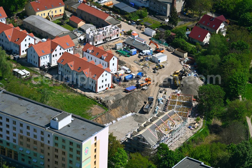 Berlin from above - Construction site for the new construction of a multi-family residential complex Wartenberger Anger on Dorfstrasse - Zum Wartenberger Anger in the Wartenberg district of Berlin, Germany