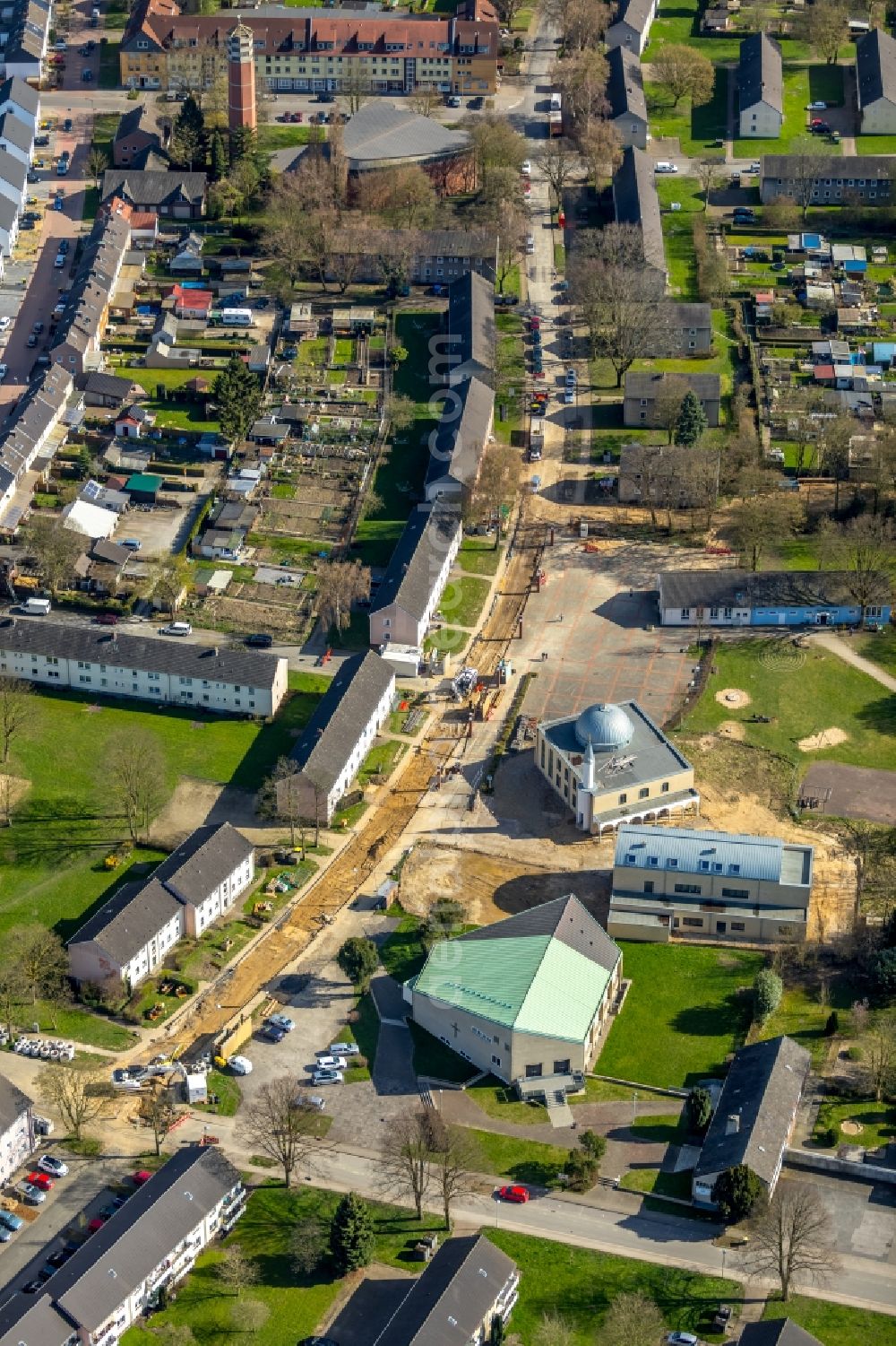 Voerde (Niederrhein) from above - Mosque construction site Yeni Yesil Cami on Schlesierstrasse opposite Evangelischen Kirche Moellen Auf dem Buender in the district Moellen in Voerde (Niederrhein) in the state North Rhine-Westphalia